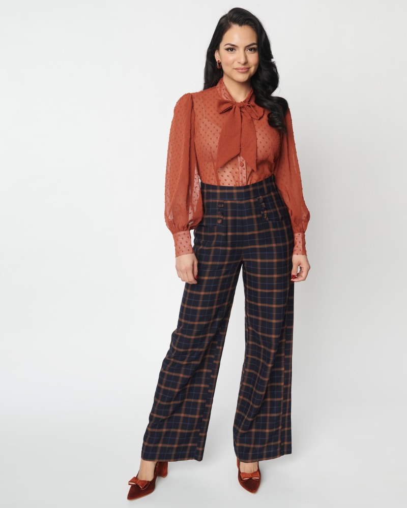 Front of a model wearing a size 3X Unique Vintage Navy & Orange Plaid High Waist Sailor Ginger Pants in Blue by Unique Vintage. | dia_product_style_image_id:306039